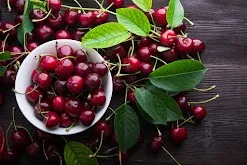 Fresh red tart cherries in a bowl